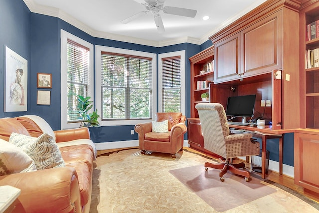 office featuring crown molding, light hardwood / wood-style flooring, and ceiling fan