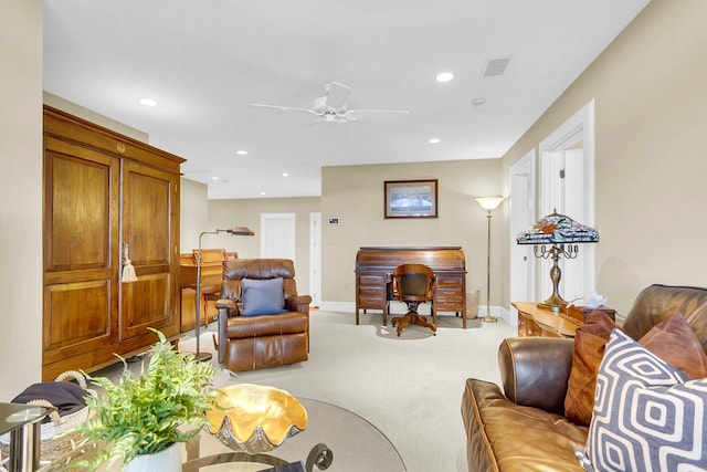 carpeted living room featuring ceiling fan