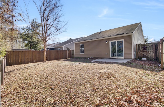 back of property featuring a patio area