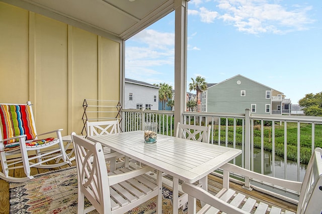 balcony featuring a water view