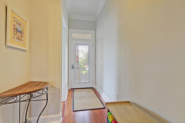 doorway to outside featuring hardwood / wood-style flooring and crown molding