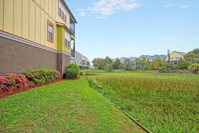 204 Michigan Ave Unit D2, Folly Beach, SC 29439 - view of green lawn featuring a residential view