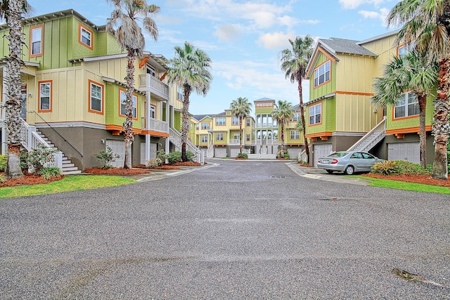 204 Michigan Ave Unit D2, Folly Beach, SC 29439 - view of asphalt road featuring stairway and a residential view