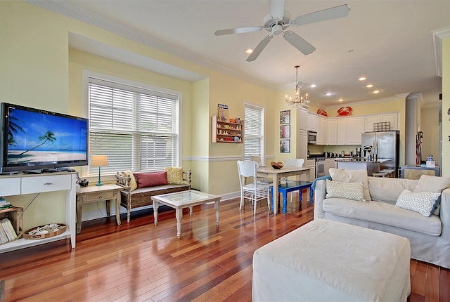 204 Michigan Ave Unit D2, Folly Beach, SC 29439 - living area featuring crown molding, a chandelier, a ceiling fan, recessed lighting, and hardwood / wood-style flooring