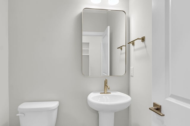 bathroom with a sink and toilet