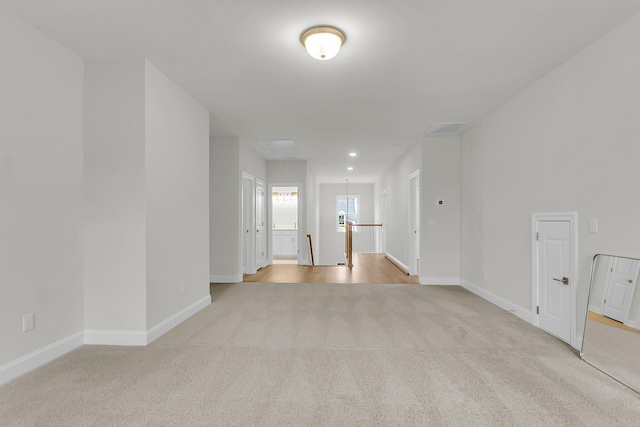 unfurnished room featuring recessed lighting, baseboards, and light colored carpet