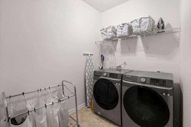 washroom featuring separate washer and dryer and light tile patterned floors