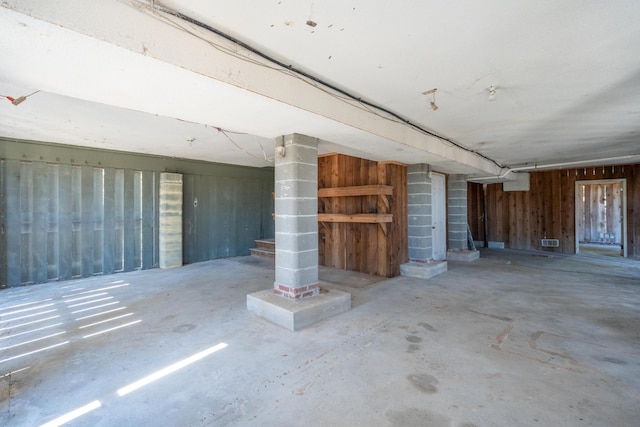 interior space featuring visible vents and wood walls