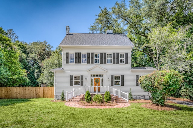 colonial home with a front yard