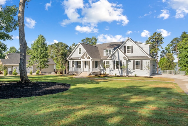 view of front of home featuring a porch and a front lawn