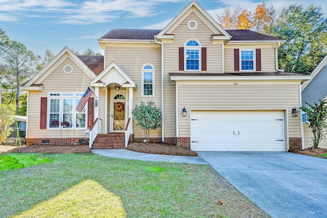 view of front of home featuring a front lawn and a garage