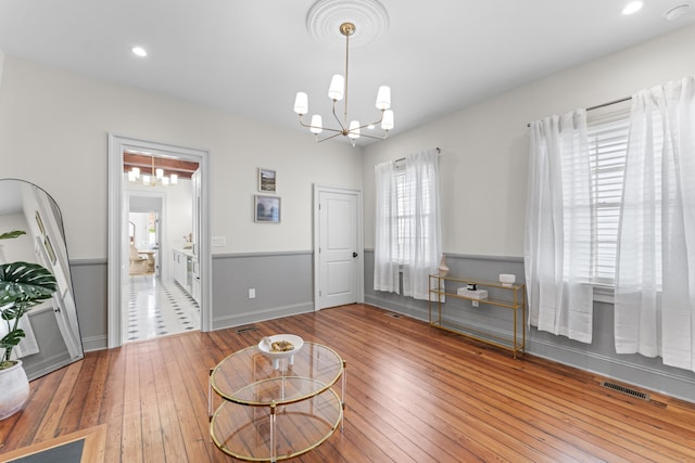 80 Smith St, Charleston, SC 29401 - living room featuring a chandelier, hardwood / wood-style flooring, recessed lighting, and baseboards