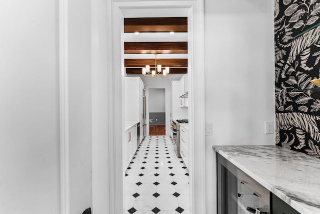 80 Smith St, Charleston, SC 29401 - corridor with a chandelier and light flooring