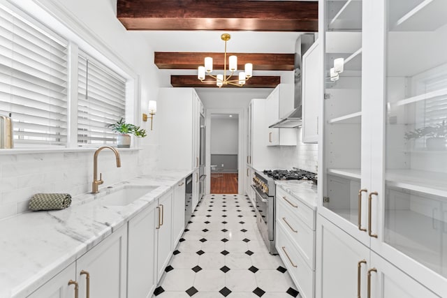 80 Smith St, Charleston, SC 29401 - kitchen with high end stainless steel range, a chandelier, a sink, beam ceiling, and white cabinets