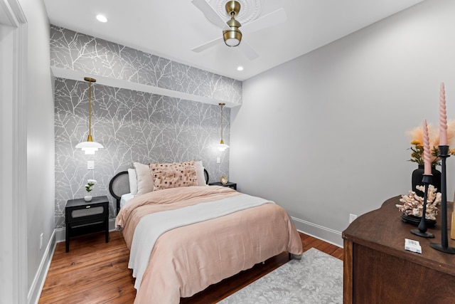 80 Smith St, Charleston, SC 29401 - bedroom featuring wallpapered walls, an accent wall, baseboards, wood finished floors, and recessed lighting