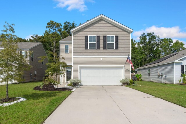 view of front of house featuring a garage and a front lawn