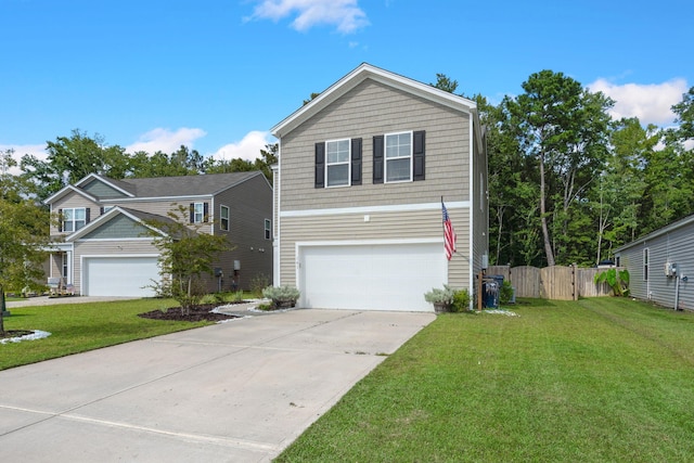 traditional home with an attached garage, concrete driveway, a front yard, and fence