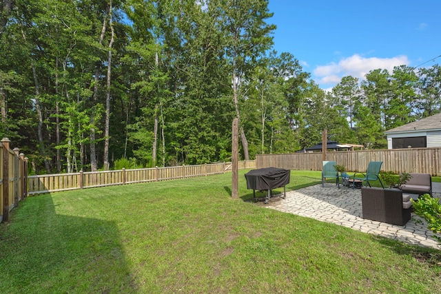 view of yard with a patio area and a fenced backyard