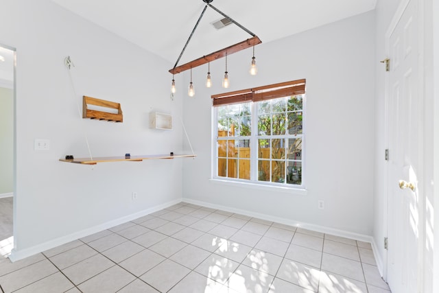 unfurnished dining area featuring light tile patterned flooring