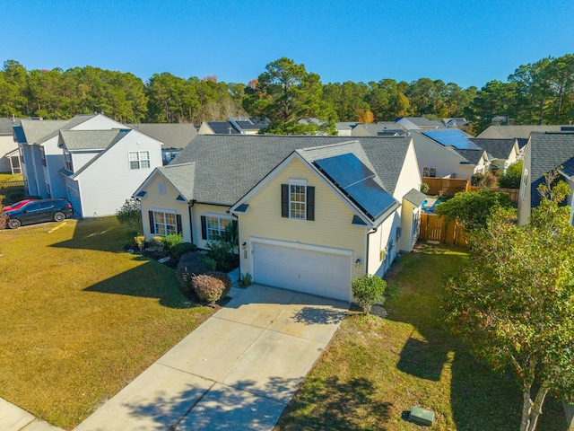 view of front of house featuring a garage and a front yard