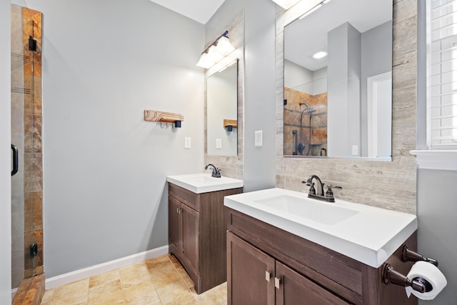 bathroom with decorative backsplash, a shower with door, and vanity