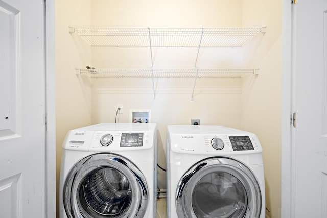 laundry area with washing machine and dryer