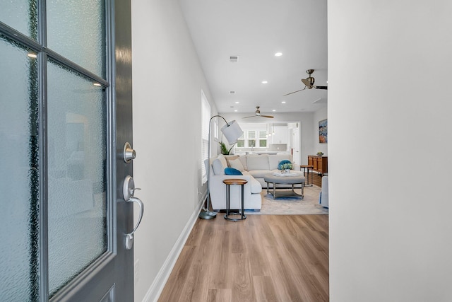 entryway featuring light hardwood / wood-style floors and ceiling fan