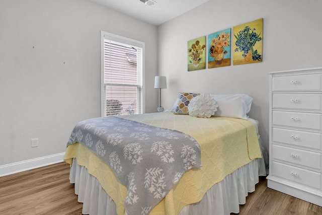 bedroom featuring hardwood / wood-style floors