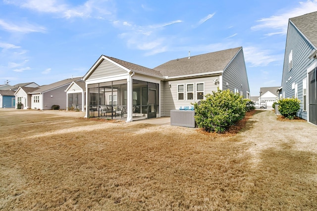 rear view of house with a sunroom