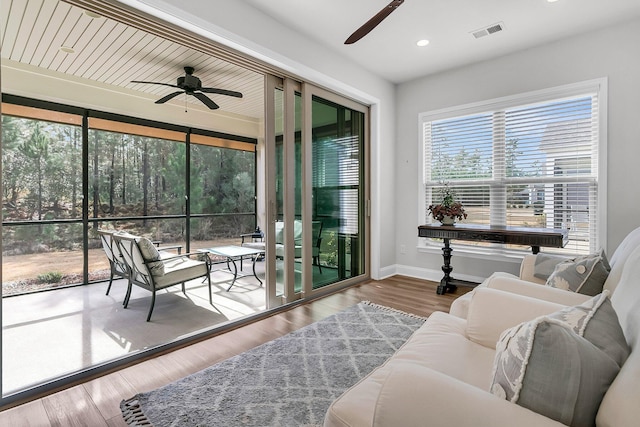 sunroom / solarium with ceiling fan