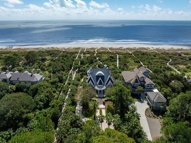 bird's eye view with a water view and a beach view