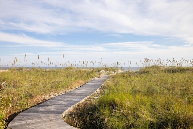 surrounding community featuring a water view