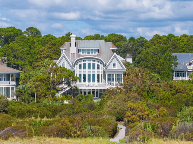 rear view of house with a balcony