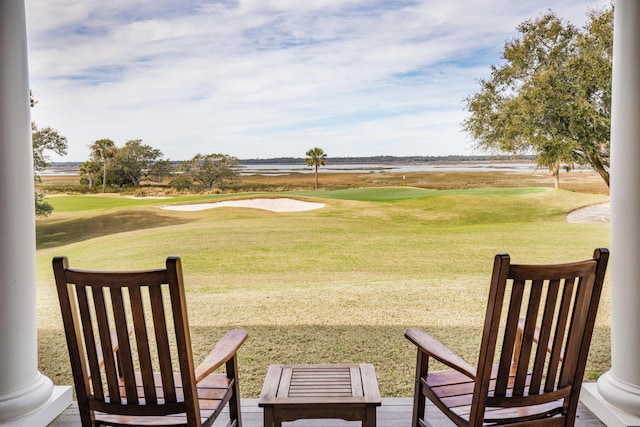 view of community featuring a water view and a lawn