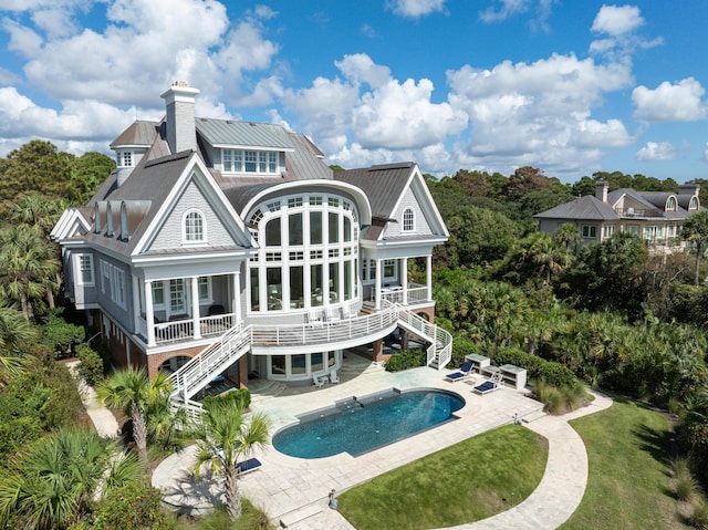 back of house with a patio