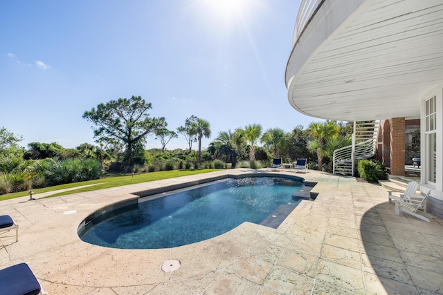 view of pool featuring a patio