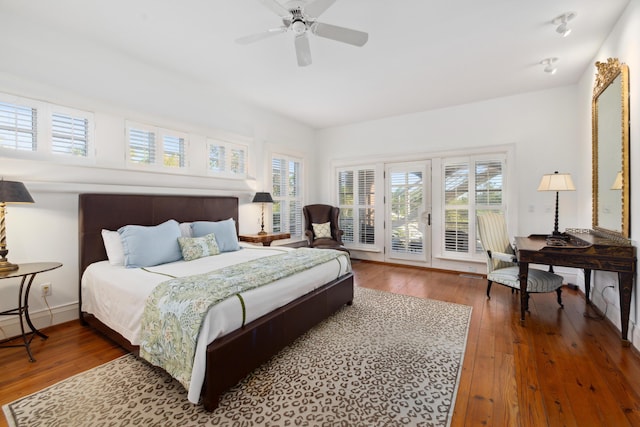 bedroom with access to outside, ceiling fan, and dark hardwood / wood-style flooring