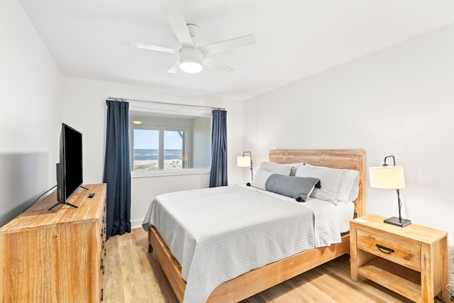 bedroom featuring light hardwood / wood-style flooring and ceiling fan