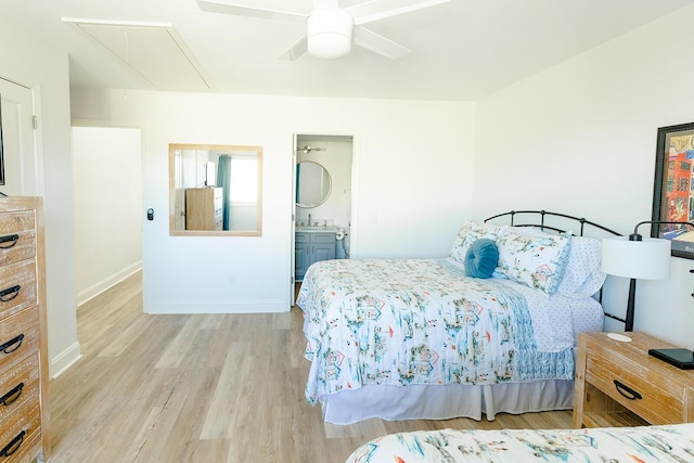 bedroom with connected bathroom, light hardwood / wood-style floors, and ceiling fan