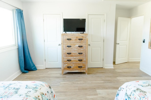 bedroom with light hardwood / wood-style flooring