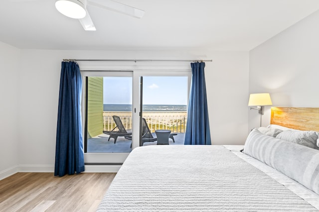 bedroom featuring access to outside, ceiling fan, and hardwood / wood-style floors