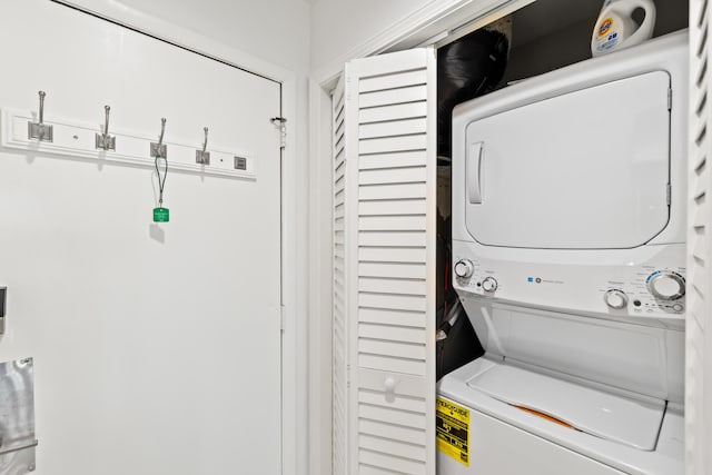 laundry area featuring stacked washing maching and dryer