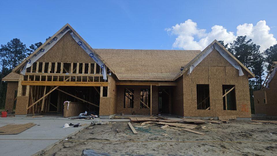 232 Huguenot Trl, Huger, SC 29450 - property in mid-construction with a shingled roof and a wooden deck