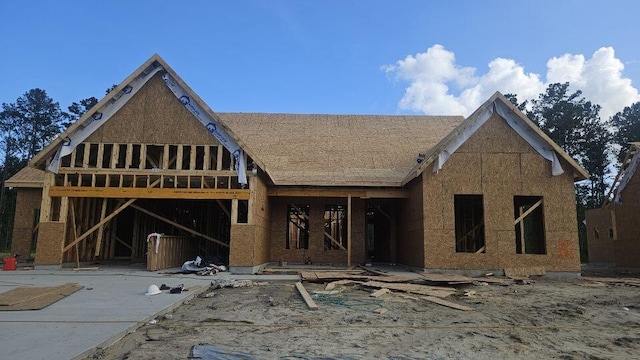 232 Huguenot Trl, Huger, SC 29450 - property in mid-construction with a shingled roof and a wooden deck