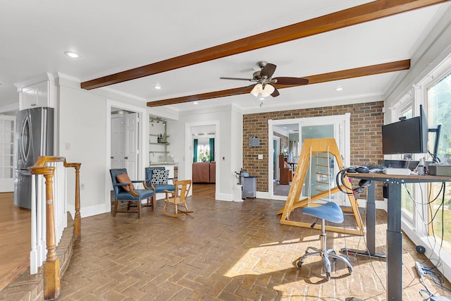 exercise room with crown molding, a healthy amount of sunlight, and ceiling fan