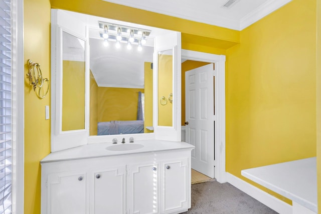 bathroom with vanity and ornamental molding