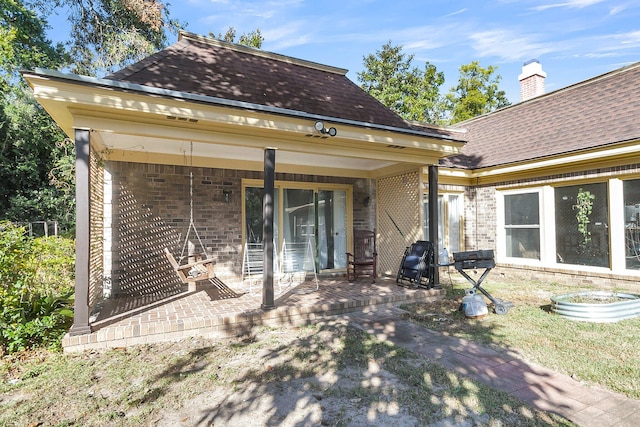 back of property with a patio area