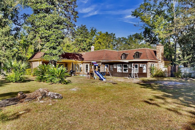 428 Carn St, Walterboro, SC 29488 - rear view of house with a chimney, fence, and a yard