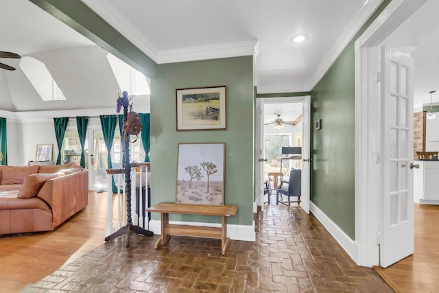 hallway with ornamental molding and hardwood / wood-style floors