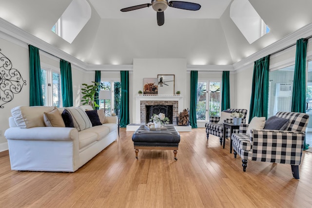 428 Carn St, Walterboro, SC 29488 - living room featuring a ceiling fan, a wealth of natural light, wood finished floors, and a fireplace